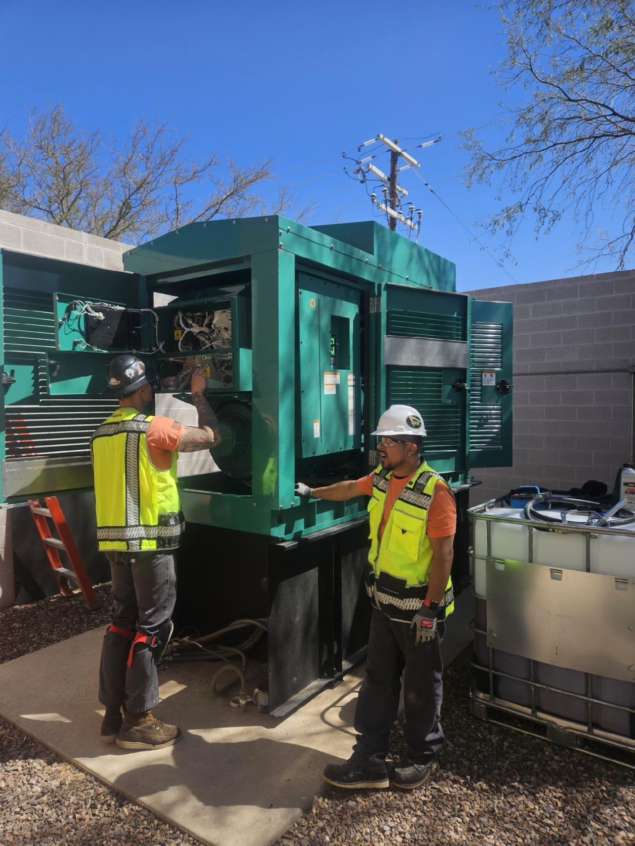 New Phase technicians servicing Cummins generator outdoors, Arizona