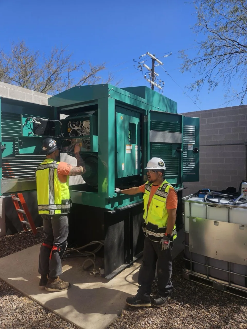 New Phase technicians servicing Cummins generator outdoors, Arizona