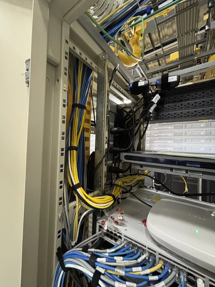 Server rack and cable infrastructure in Arizona data center, serviced by New Phase Electrical